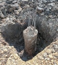 Concrete circle pole in dig out of hole for make foudation pile. Building house in construction site