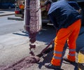 Concrete colored red by a worker