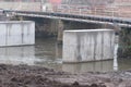 Concrete columns in the water, bridge construction on the Olt river. Royalty Free Stock Photo