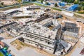 Concrete construction site for big building foundation. tower cranes working on the construction site. aerial view