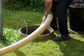 Septic tank: the cleaning of a domestic septic tank (MGW2057A1518) Royalty Free Stock Photo