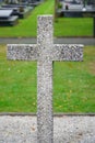 Concrete cross on a grave. Historic graveyard.