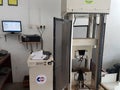 Concrete cube strength compression test at the laboratory using compression machine.