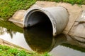 Concrete culvert pipe hole system draining sewage water. Environmental disaster Royalty Free Stock Photo