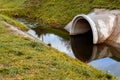 Concrete culvert pipe hole system draining sewage water. Environ Royalty Free Stock Photo