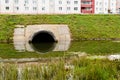 Concrete culvert pipe hole system draining sewage water near the Royalty Free Stock Photo