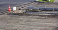 Concrete curb installation. Traffic cone is using during road work Royalty Free Stock Photo