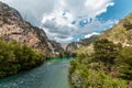 Concrete Dam among the rocks. Reservoir, hydroelectric power plant, clean electricity Royalty Free Stock Photo