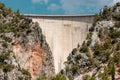 Concrete Dam among the rocks. Reservoir, hydroelectric power plant, clean electricity Royalty Free Stock Photo