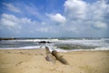 Concrete drain pipeline at coastline. soft white wave hitting the beac Royalty Free Stock Photo