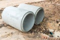 Concrete Drainage Pipe on a Construction Site. Concrete drainage pipes stacked for construction. Concrete drainage tube on constr