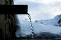 Concrete drinking trough for cattle or farm animals in the village, flowing clear and cold spring water from mountains