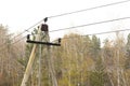 Concrete electric pole providing electricity to remote settlements. Royalty Free Stock Photo