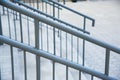 Concrete entrance stairs with metal railings