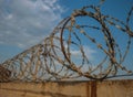 Concrete fence with barbed iron wire Royalty Free Stock Photo