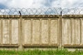 Concrete fence with barbed wire Royalty Free Stock Photo