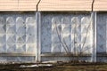 Concrete fence with barbed wire around the perimeter. Territory