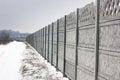 Concrete fence. Winter. Royalty Free Stock Photo