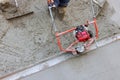 Concrete finishing work in progress with troweling machine at construction site Royalty Free Stock Photo
