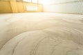 Concrete floor grinding. Construction process. Sanding a concrete floor with a sander in a warehouse