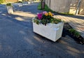 concrete flower pots form an obstacle at the crossing near the