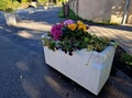 concrete flower pots form an obstacle at the crossing near the