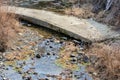 Concrete footbridge over small stream