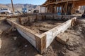 Concrete foundation forms ready for pouring at a new house construction site Royalty Free Stock Photo