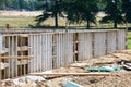 Concrete foundation with reinforcement and metal slab construction site, process of house building formwork for foundation Royalty Free Stock Photo
