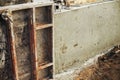 Concrete foundation with reinforcement and metal slab. Formwork for foundation. Construction site, process of house building. New Royalty Free Stock Photo