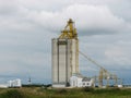 Concrete Grain Elevator with Cloudy Sky on Prairie