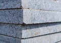 Concrete or granite gray square pavement slabs or stones for floor, wall or path stacked. Industry manufacturing or building conce Royalty Free Stock Photo