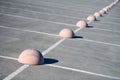 Concrete hemispheres parking limiter. Protection from car parking. Elements to restrict access to parking zone and control Royalty Free Stock Photo