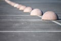 Concrete hemispheres parking limiter. Protection from car parking. Elements to restrict access to parking zone and control Royalty Free Stock Photo