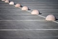 Concrete hemispheres parking limiter. Protection from car parking. Elements to restrict access to parking zone and control Royalty Free Stock Photo