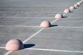 Concrete hemispheres parking limiter. Protection from car parking. Elements to restrict access to parking zone and control Royalty Free Stock Photo