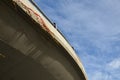 Concrete highway driveway curled into an elevated bend on one concrete pole. formwork decals used in concrete casting are visible. Royalty Free Stock Photo