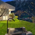 Concrete house with stone fountain