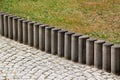 Concrete kerb between lawn and cobbled sidewalk in a park Royalty Free Stock Photo
