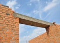 Concrete lintel. Window or door concrete lintel on brick unfinished house construction. Royalty Free Stock Photo