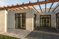 Concrete, loft house with wooden stakes on roof