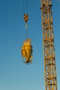 Concrete machine for spreading cement hoisted at building site