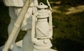 Concrete made statue of a traditional lantern in a park