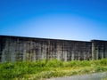 Concrete masonry block wall with green grass in front Royalty Free Stock Photo