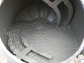 Concrete mixer with pouring cement. Close up on concrete mixer, cement mortar mixing