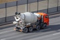 Concrete mixer truck rides on city highway