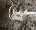 Concrete mixing with electrical drill and mixer Royalty Free Stock Photo
