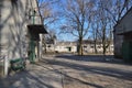 Concrete old buildings stables green doors and broken windows an abandoned place Royalty Free Stock Photo