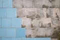 Concrete old wall with the remains of tiles and tile mortar. Background, texture.