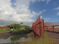 Concrete outdoor bridge with red fences on blue summers sky background over the beach. Royalty Free Stock Photo